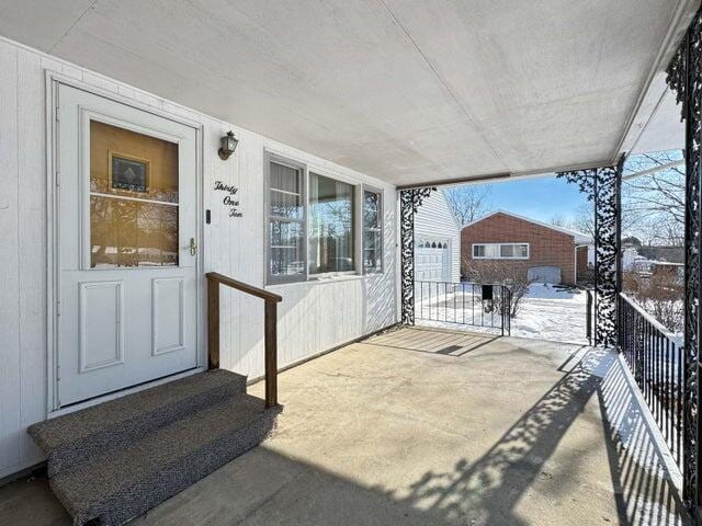 view of patio / terrace featuring a garage