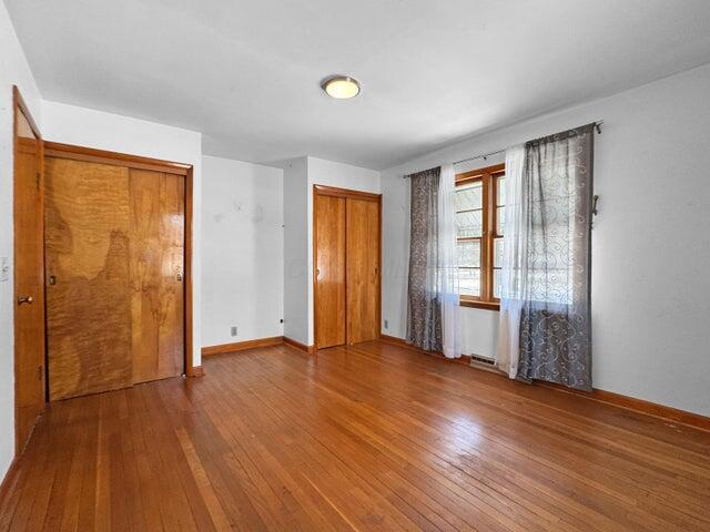 unfurnished bedroom featuring wood-type flooring