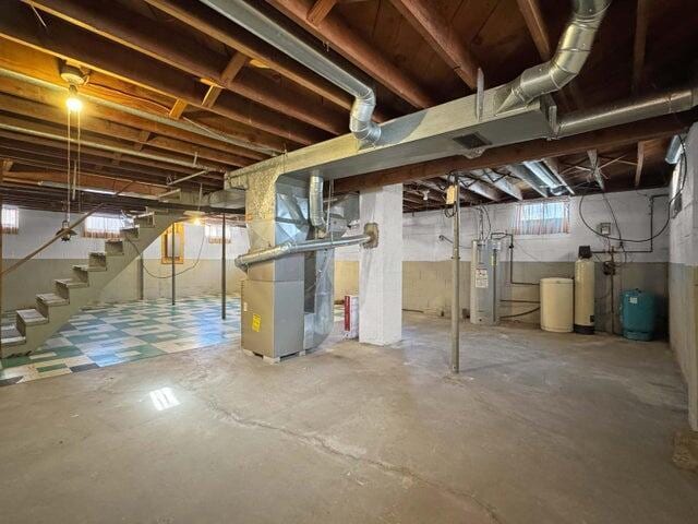 basement with heating unit and water heater