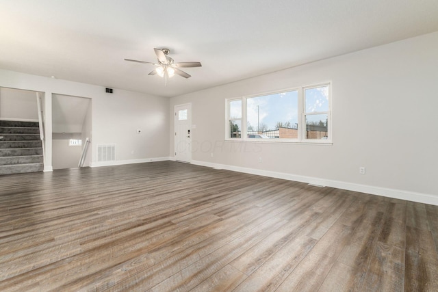 unfurnished living room with ceiling fan and wood-type flooring