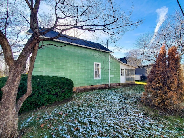 view of home's exterior featuring a sunroom