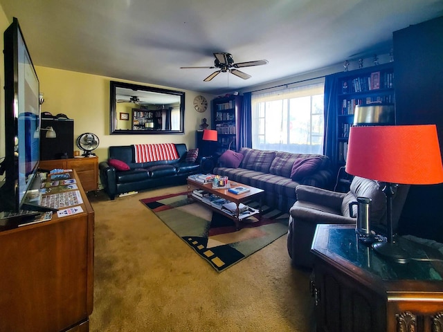 carpeted living room featuring ceiling fan