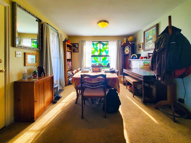 dining space with light colored carpet