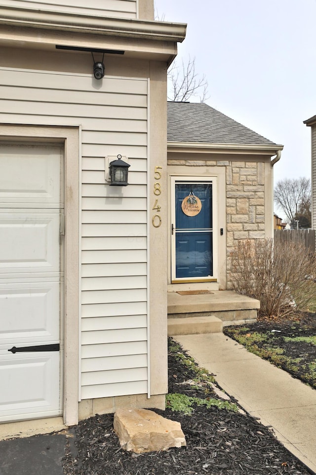 view of exterior entry featuring a garage