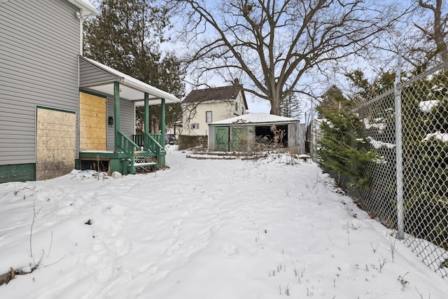 view of yard layered in snow