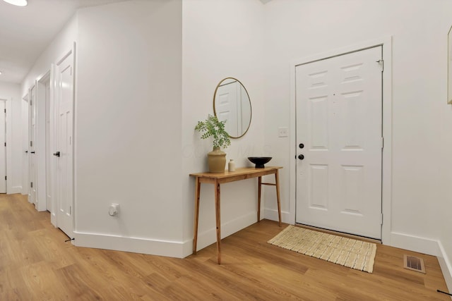 entryway with light hardwood / wood-style floors