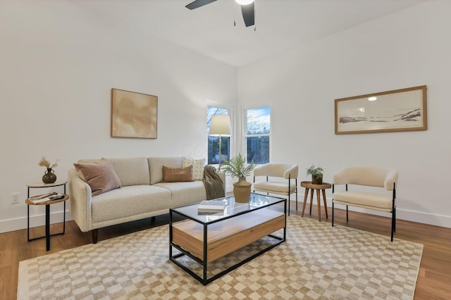 living room with ceiling fan and light wood-type flooring