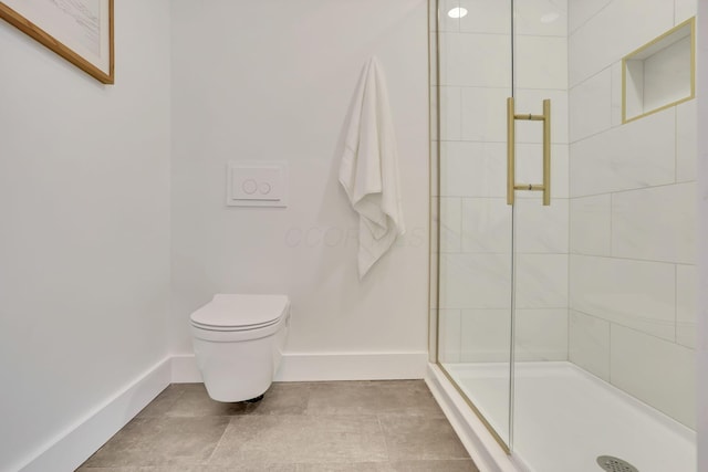 bathroom with an enclosed shower and toilet