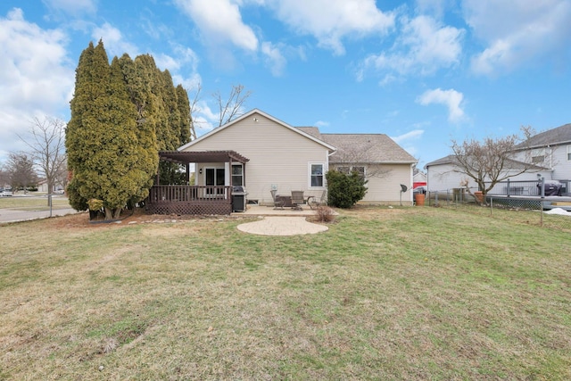 back of property featuring a patio, a yard, a deck, and a pergola