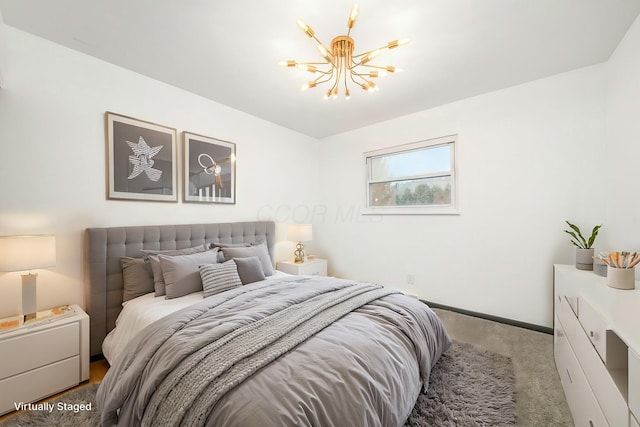 bedroom with an inviting chandelier and carpet