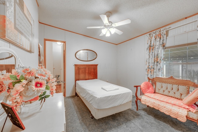 carpeted bedroom featuring ceiling fan, ornamental molding, and a textured ceiling