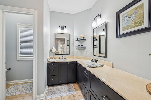 bathroom with tile patterned flooring and vanity