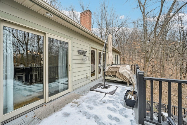 view of snow covered deck