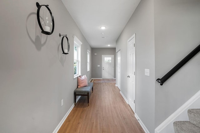 hall with light wood-type flooring