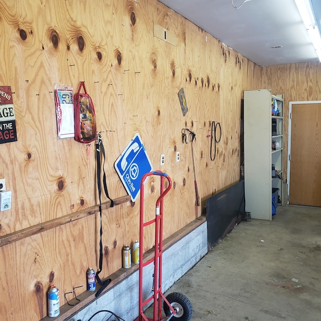 workout area featuring wood walls