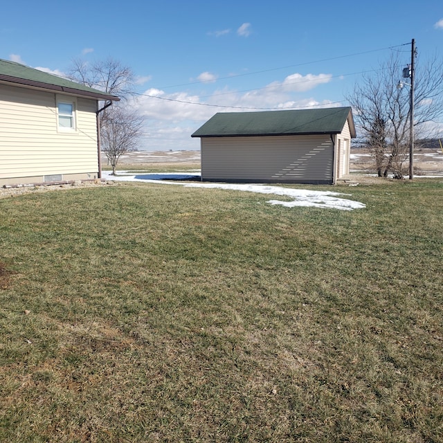 view of yard with an outbuilding and a garage