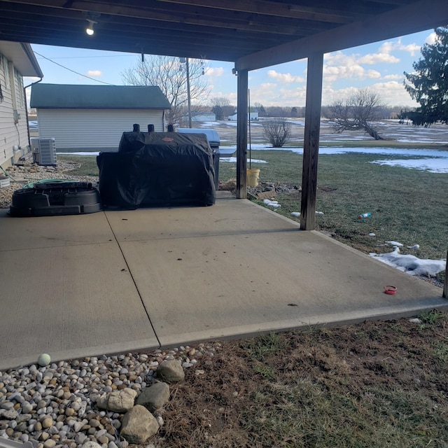 view of patio / terrace featuring a water view and central air condition unit