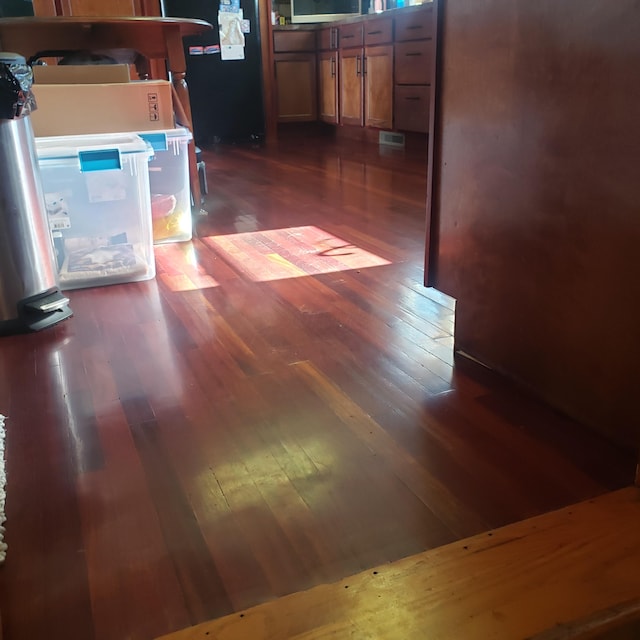 corridor featuring dark hardwood / wood-style flooring