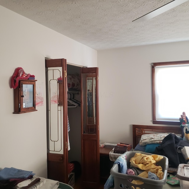 bedroom featuring a textured ceiling