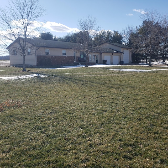 exterior space with a garage and a front yard