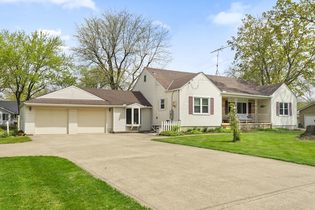 view of front facade featuring an attached garage, concrete driveway, a porch, and a front lawn