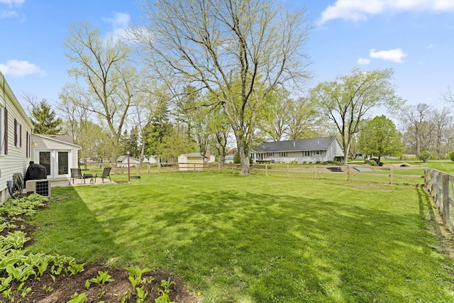 view of yard with a fenced backyard and a patio area