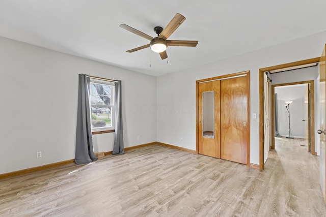 unfurnished bedroom featuring baseboards, ceiling fan, and light wood-style floors