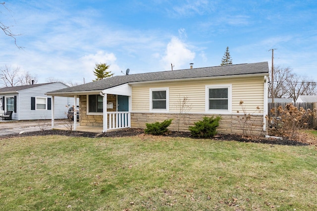 view of front of house featuring a front yard and covered porch