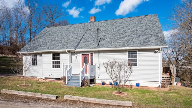 cape cod-style house with a front lawn