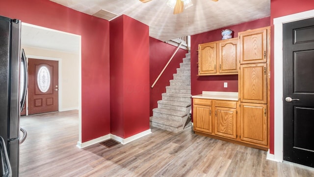 interior space featuring ceiling fan and light hardwood / wood-style flooring