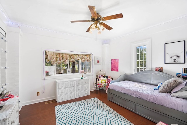 bedroom featuring ceiling fan and dark hardwood / wood-style flooring