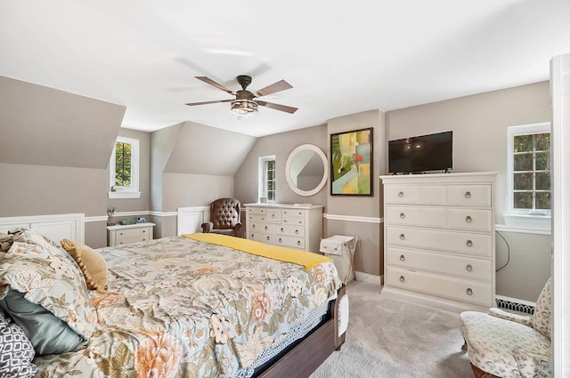 carpeted bedroom with lofted ceiling and ceiling fan