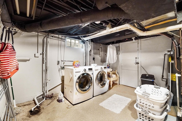 clothes washing area with independent washer and dryer and water heater