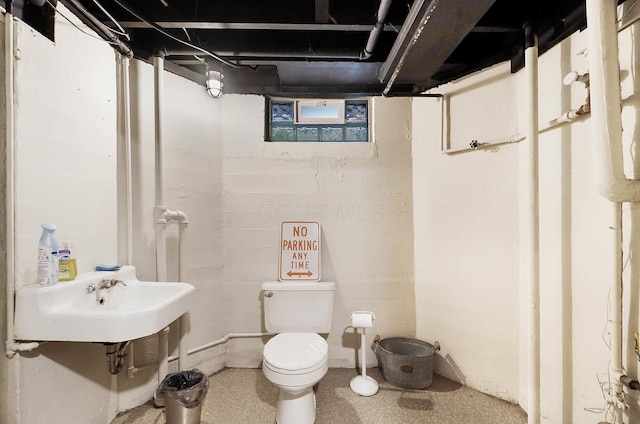 bathroom featuring sink and toilet