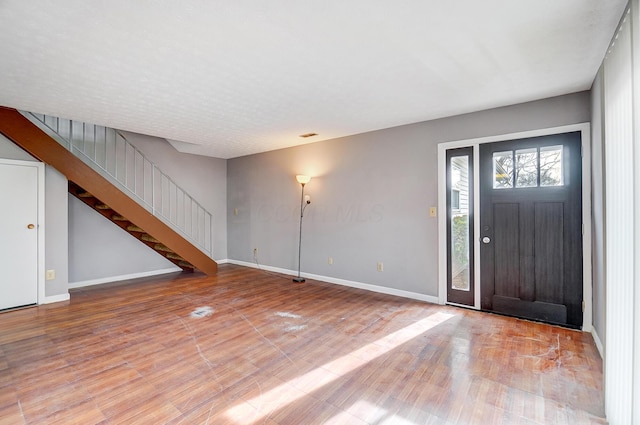 foyer entrance featuring wood-type flooring