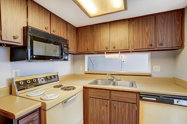 kitchen with white electric range, dishwasher, and sink