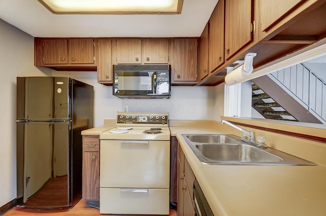 kitchen featuring sink and black appliances