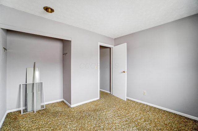 unfurnished bedroom with carpet flooring