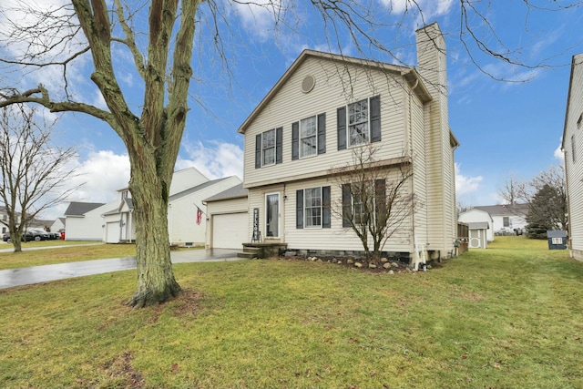 view of front of house with a garage and a front lawn