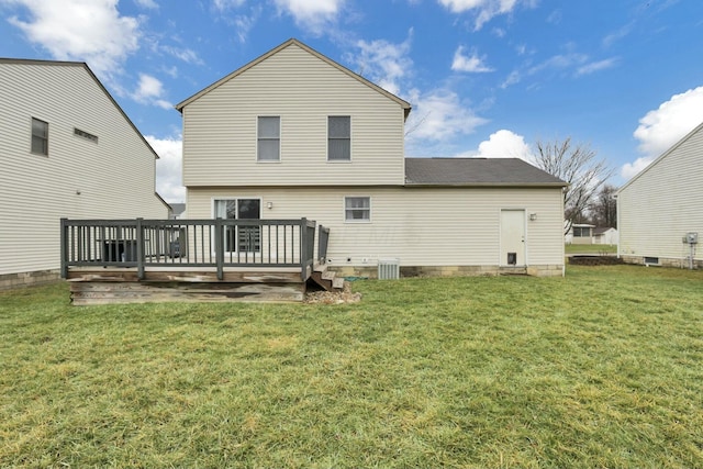 back of property featuring a yard and a deck