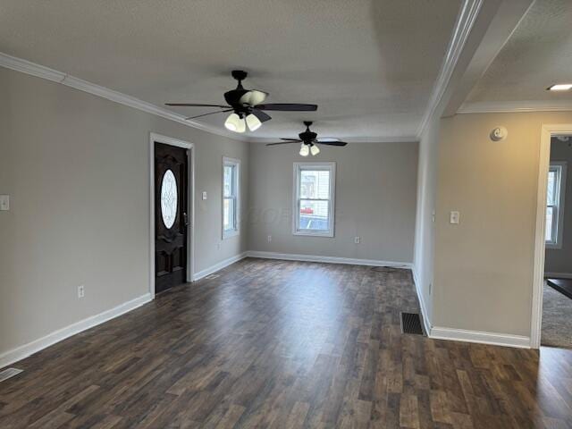 spare room with ornamental molding and dark hardwood / wood-style flooring