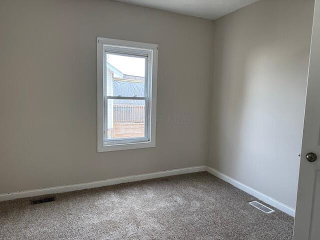 unfurnished room with carpet floors