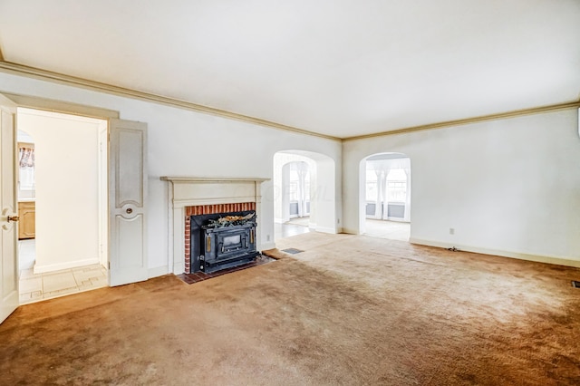 unfurnished living room featuring ornamental molding and carpet