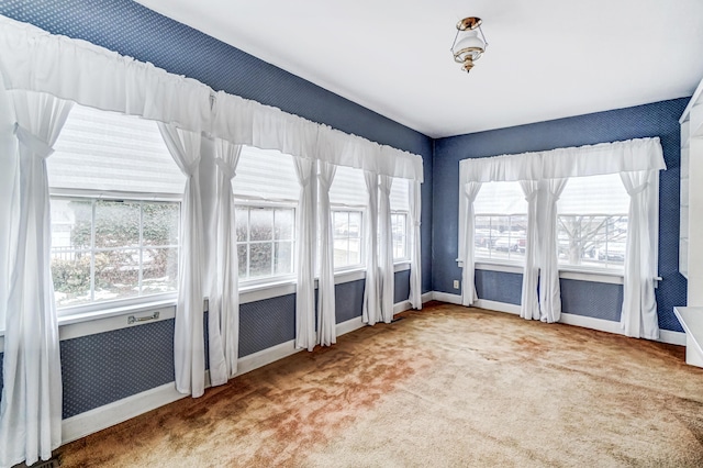 unfurnished sunroom with a healthy amount of sunlight