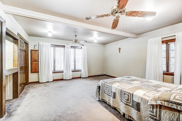 bedroom featuring multiple windows, carpet floors, and ceiling fan