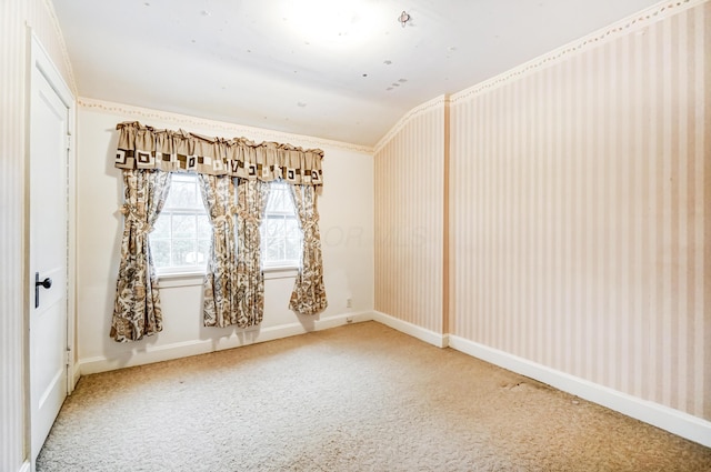 carpeted empty room with lofted ceiling