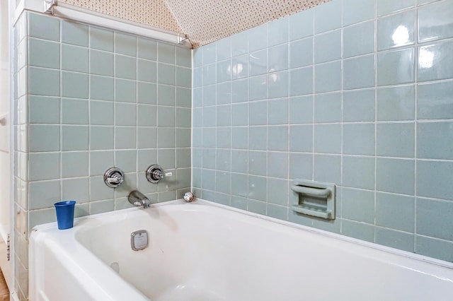 bathroom with a tub