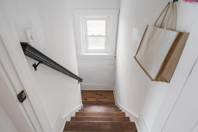 stairs with hardwood / wood-style floors