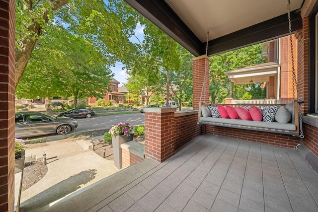 view of patio featuring outdoor lounge area and covered porch