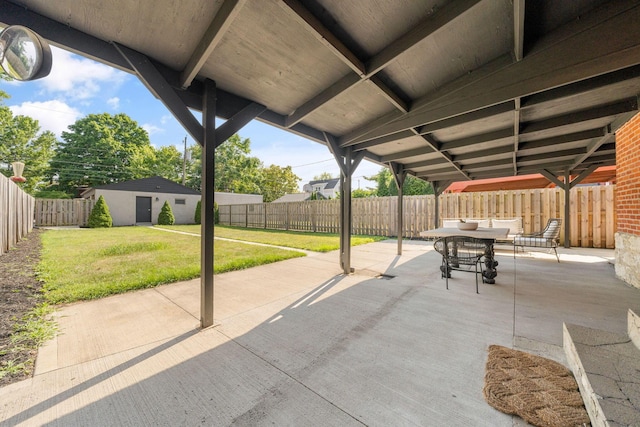 view of patio / terrace with an outbuilding